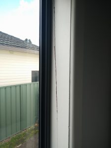 A huge split in the window frame.